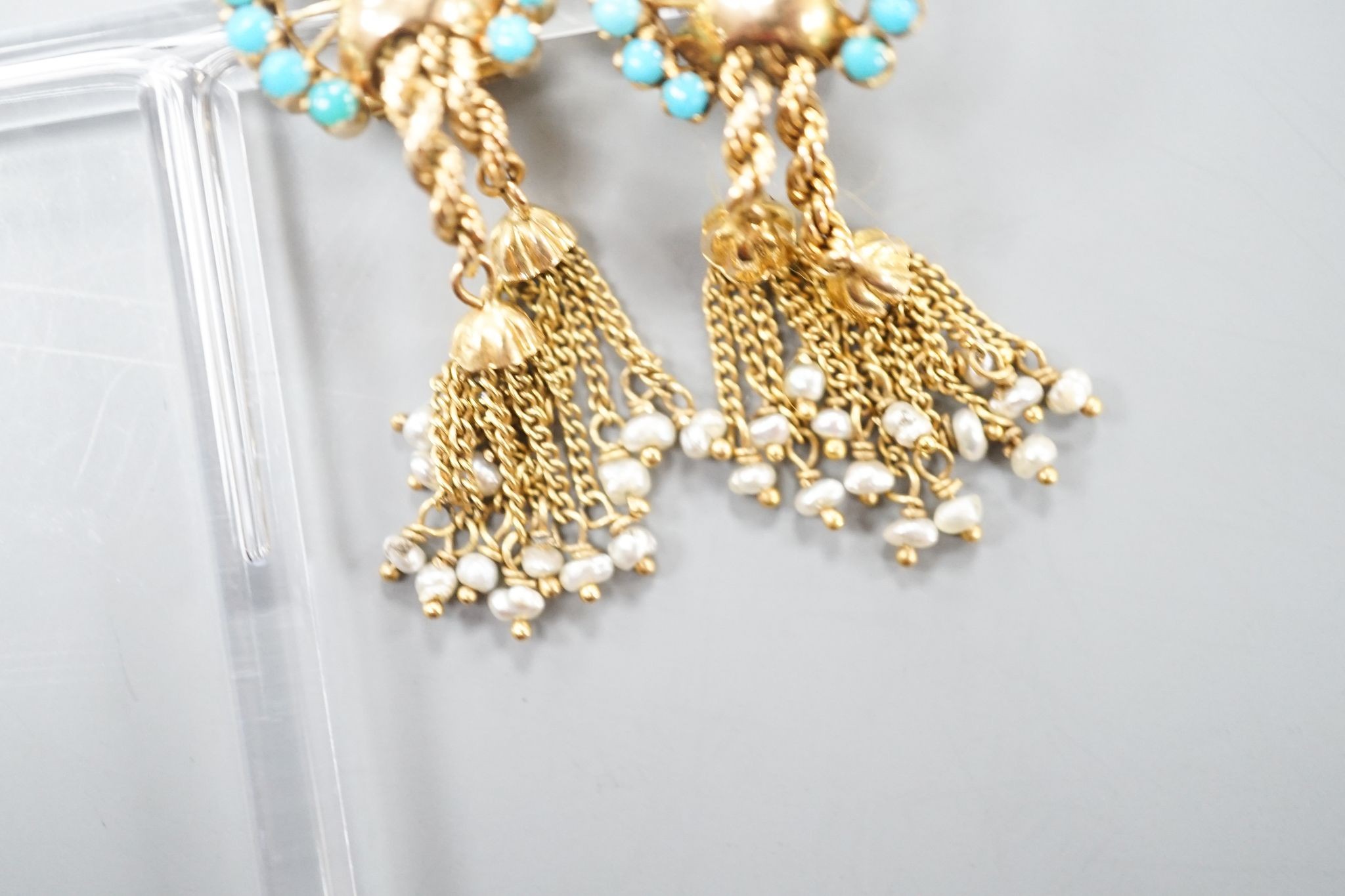 A pair of 20th century Middle Eastern yellow metal, seed pearl and turquoise set tassel drop ear clips, 47mm, gross weight 12.5 grams.